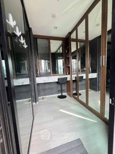 Luxurious modern bathroom with mirrored cabinets and sleek design