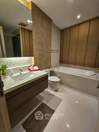 Modern bathroom with sleek fixtures and bathtub in a stylish apartment