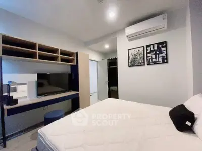 Modern bedroom with built-in desk and air conditioning