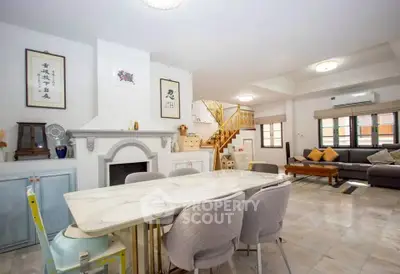 Spacious living room with elegant dining area and modern decor