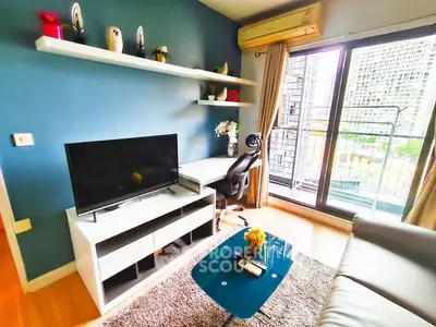 Modern living room with balcony view, stylish decor, and cozy seating area.