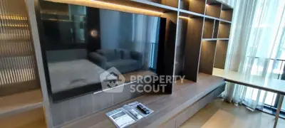 Modern living room with built-in TV unit and cozy seating area