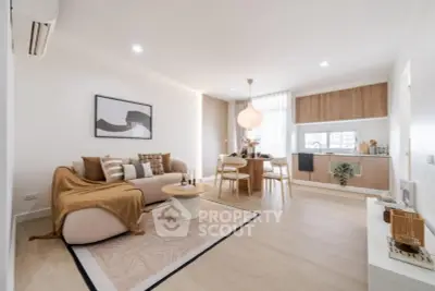 Modern open-plan living room with stylish decor and natural light