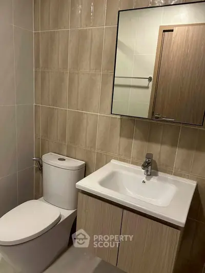 Modern bathroom with sleek fixtures and neutral tile design