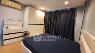 Cozy bedroom with modern furniture and ample storage space