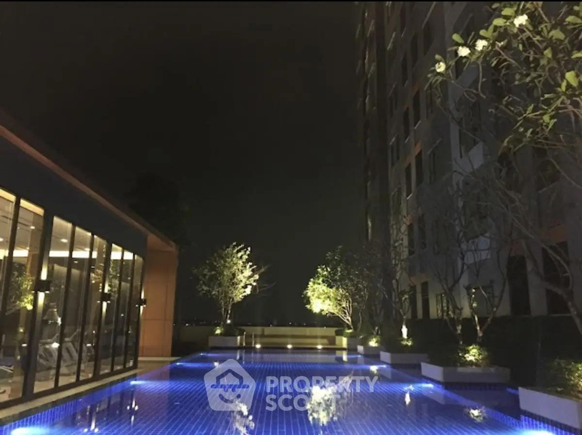 Luxurious night view of illuminated poolside at modern residential complex
