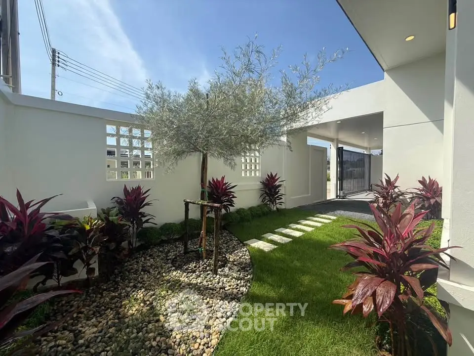 Charming garden with lush greenery and modern design in a serene residential setting.