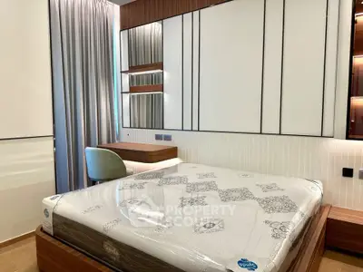 Modern bedroom with stylish decor and comfortable bed in a contemporary apartment.