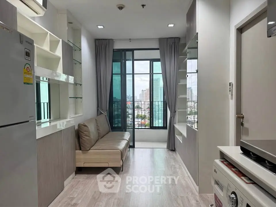 Modern living room with city view, featuring sleek furniture and built-in storage, perfect for urban living.