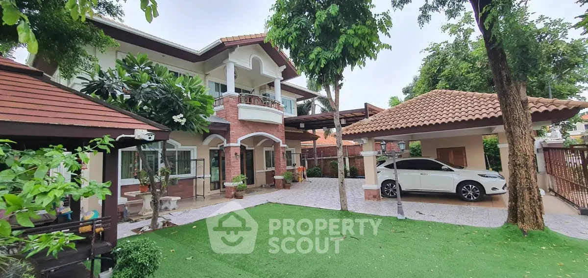 Charming two-story house with lush garden and carport in serene neighborhood