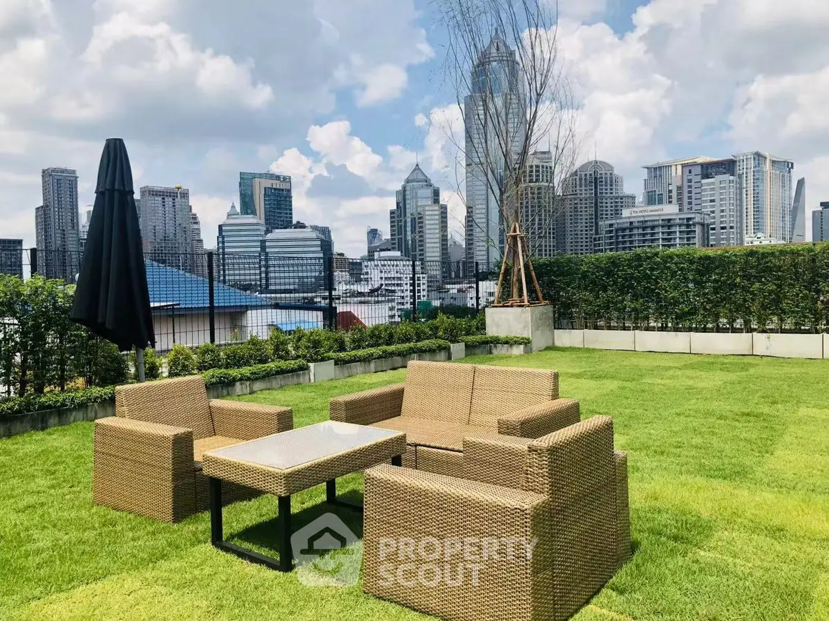 Luxurious rooftop garden with city skyline view and stylish outdoor seating.