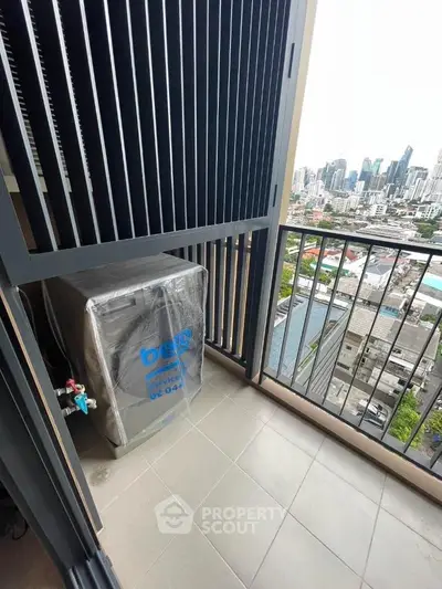 Modern balcony with city view and washing machine in high-rise apartment