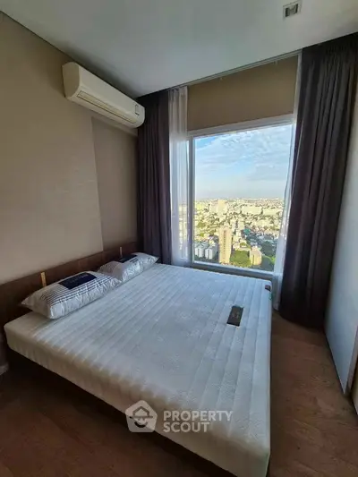 Luxurious bedroom with stunning city view and modern decor