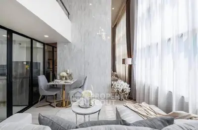 Luxurious modern living room with high ceilings and elegant decor