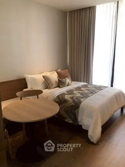 Cozy bedroom with modern decor and natural light