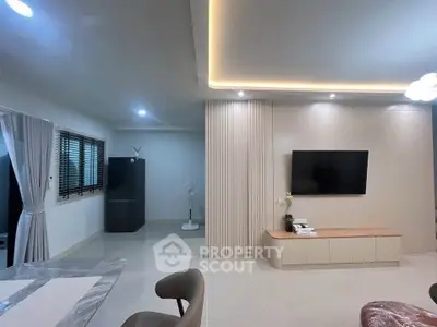 Modern living room with sleek TV setup and elegant lighting