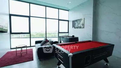 Luxurious game room with pool table and modern decor in high-rise apartment