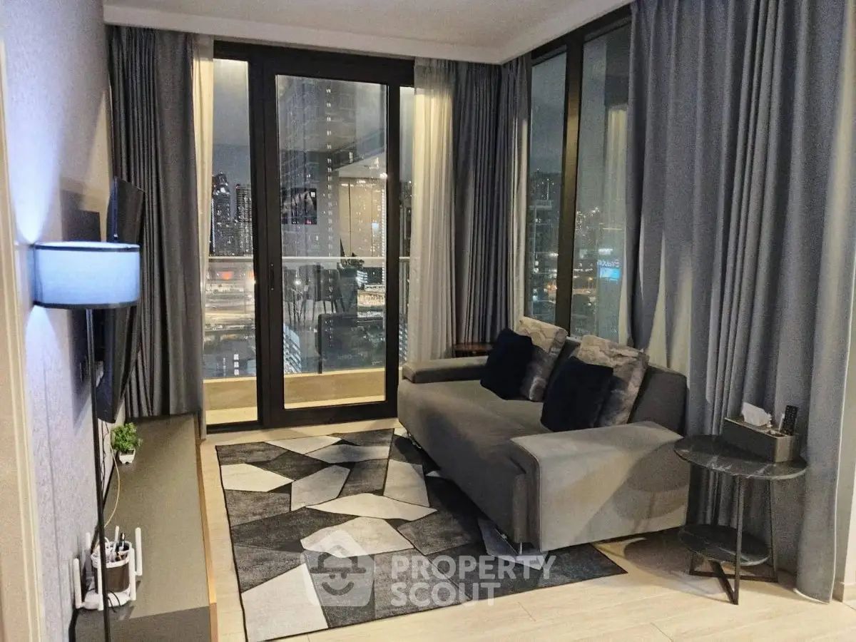 Modern living room with city view, stylish decor, and floor-to-ceiling windows.