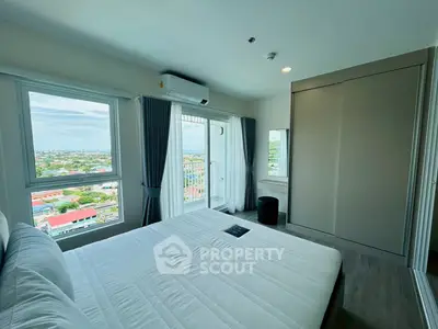 Bright bedroom with panoramic city view and modern decor