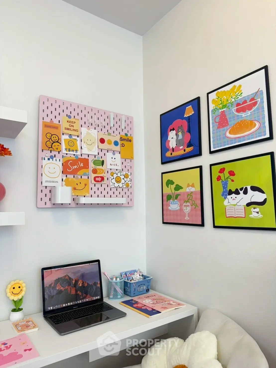 Charming study nook with vibrant wall art and cozy decor