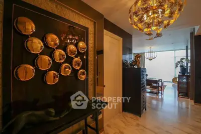 Luxurious living room with elegant decor and unique lighting fixture