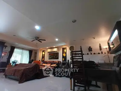 Spacious living room with modern decor and ample natural light