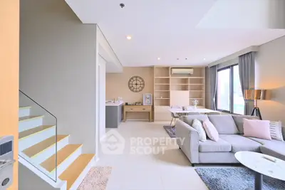 Spacious modern living room with elegant decor and natural light