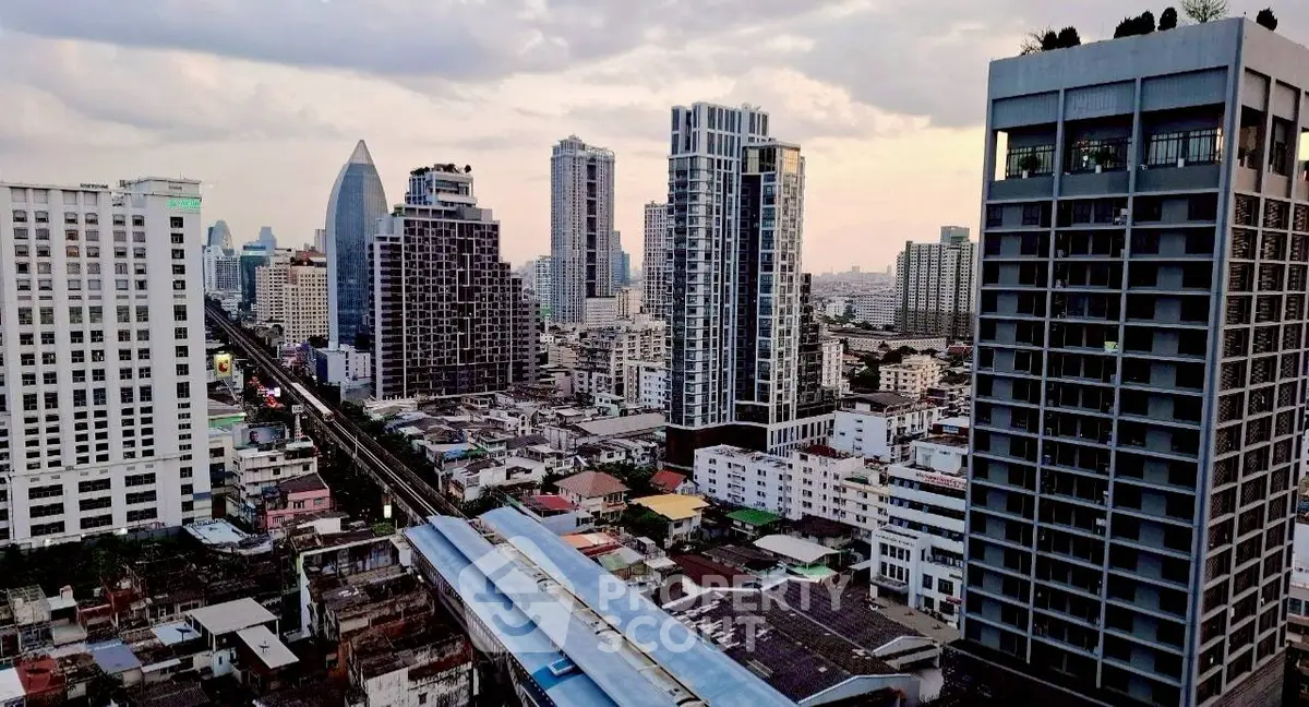 Stunning cityscape view of modern high-rise buildings at dusk, showcasing urban living.