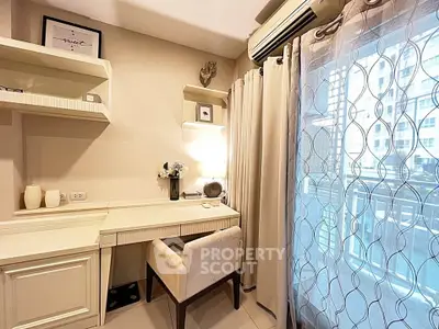 Chic study room with elegant desk and natural light from balcony