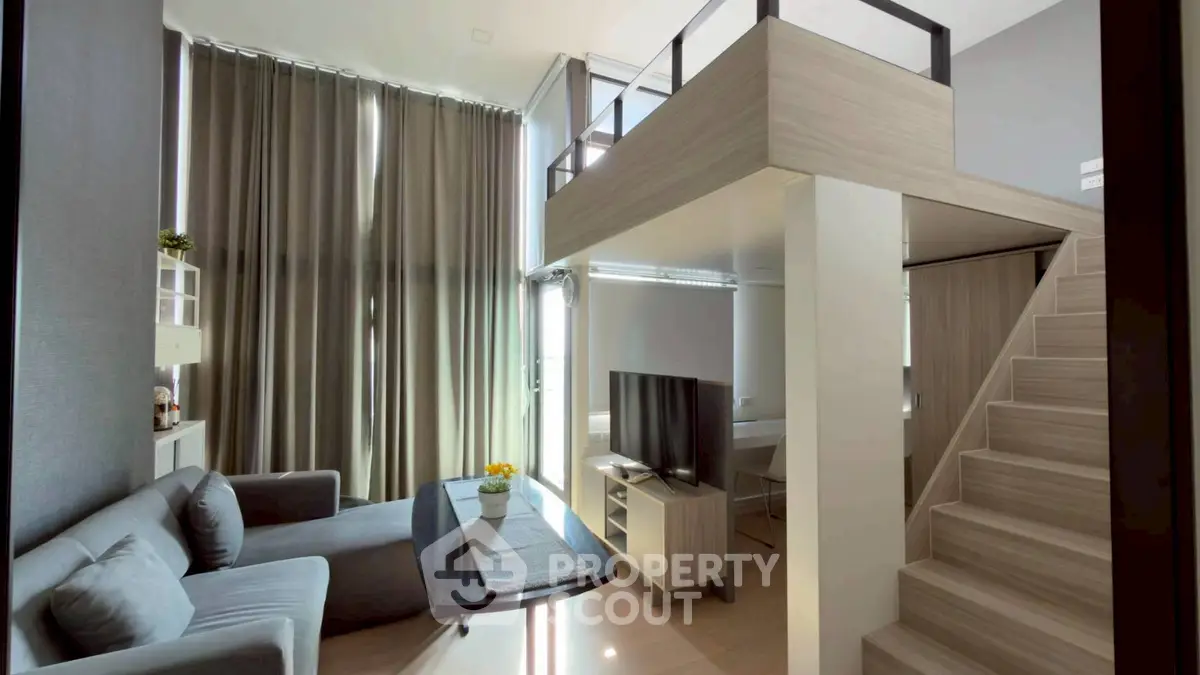 Modern loft-style living room with high ceilings and stylish decor