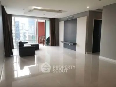 Spacious modern living room with city view and minimalist design.