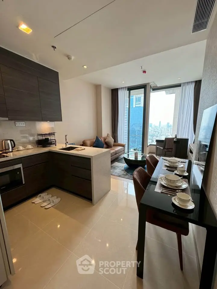 Modern open-layout kitchen and living room with city view in luxury apartment