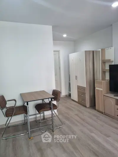 Modern apartment interior with stylish furniture and wooden flooring, perfect for urban living.