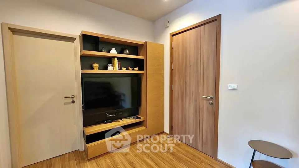 Modern living room with wooden flooring and stylish TV unit