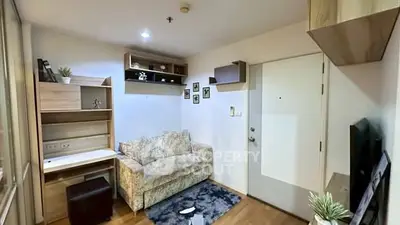 Cozy living room with modern decor and comfortable sofa in a stylish apartment.