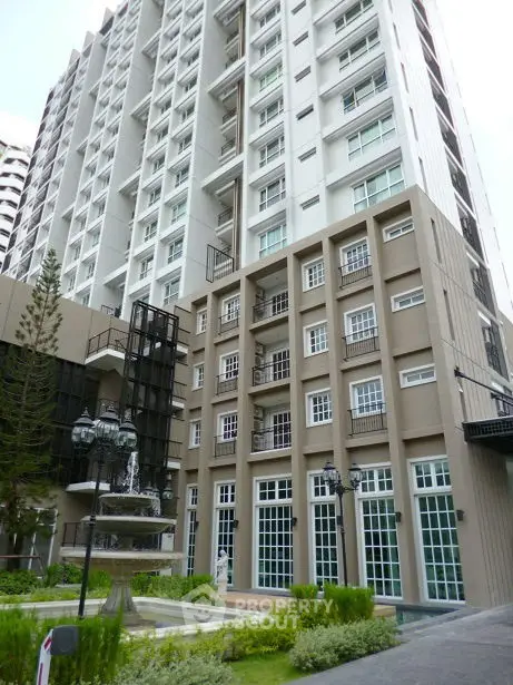 Stunning modern high-rise building with elegant facade and lush landscaping
