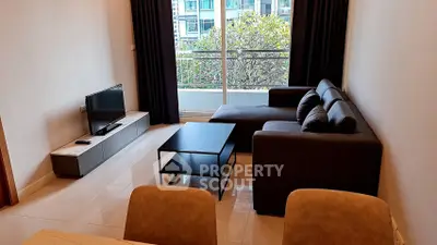 Modern living room with sleek furniture and balcony view in urban apartment