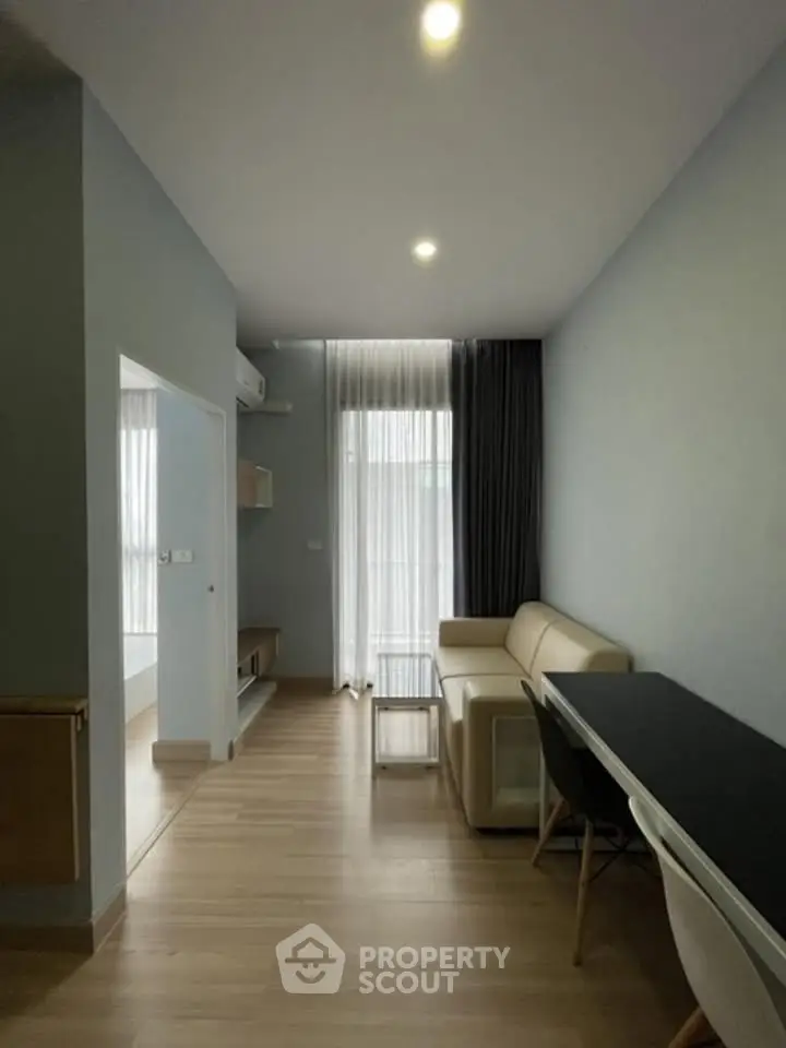 Modern living room with sleek furniture and natural light