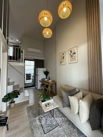 Modern loft-style living room with high ceiling and stylish decor