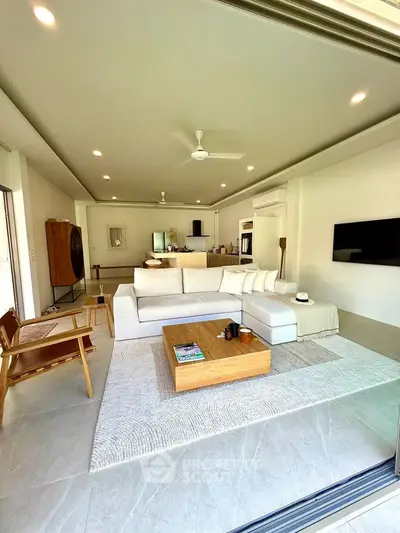 Spacious modern living room with elegant decor and open layout, perfect for relaxation and entertainment.