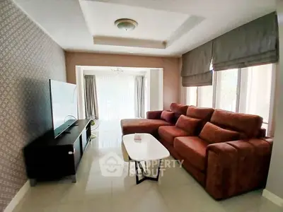 Spacious living room with modern decor and large sofa