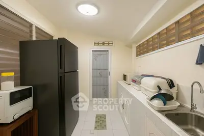 Modern kitchen with sleek appliances and ample storage space