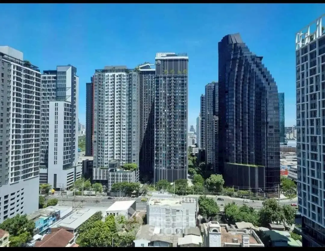 Stunning cityscape view of modern high-rise buildings under a clear blue sky.