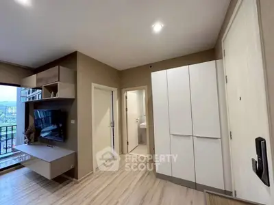 Modern living room with balcony view and sleek storage solutions