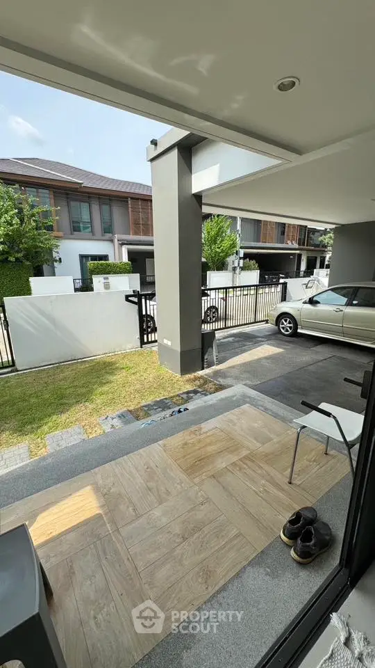 Modern residential driveway with car and stylish entrance