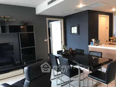 Modern living room with sleek black dining table and stylish decor