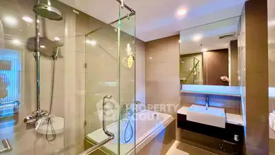 Luxurious modern bathroom with glass shower and bathtub