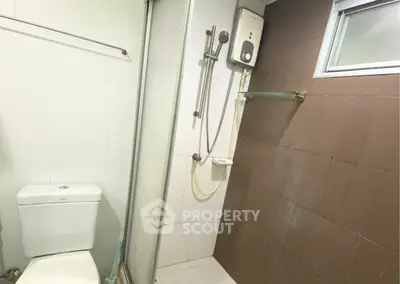 Modern bathroom with shower and water heater in sleek design