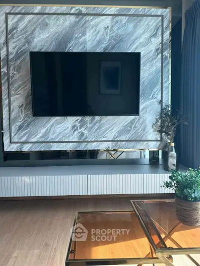 Luxurious living room with modern TV setup and elegant decor