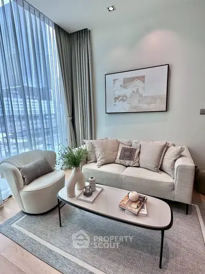 Modern living room with elegant decor and large window view